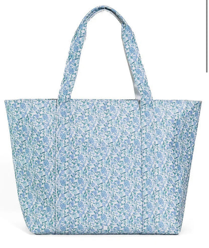 TRVL XL JUMBO TOTE with luggage slide on suitcase